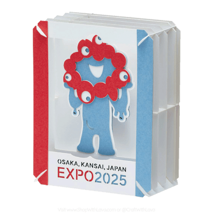 Small paper craft kit called paper theater with a cartoon character, an ambassador for Expo 2025. It has a red head, blue body. And Osaka, Kansai, Japan Expo 2025 text.